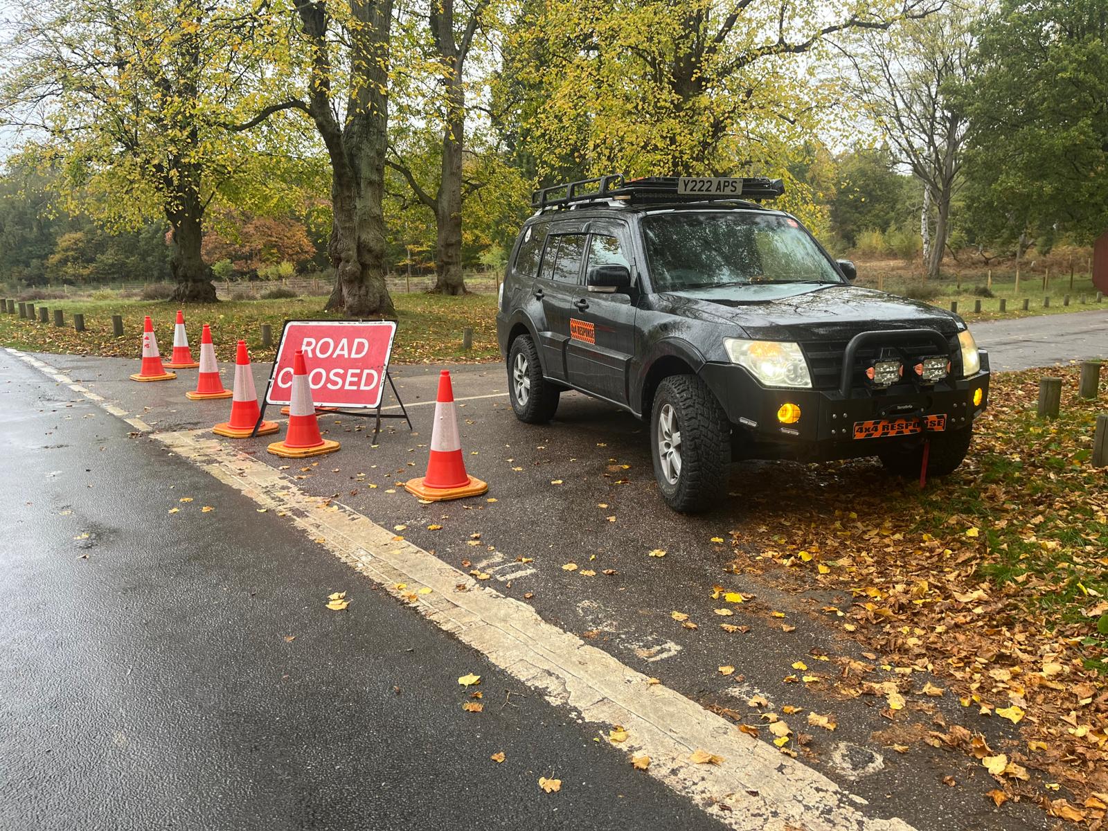 A 4x4 Response vehicle holding a road closure during a community event.